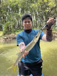 Guest showing caught fish during guided mangrove forest tour