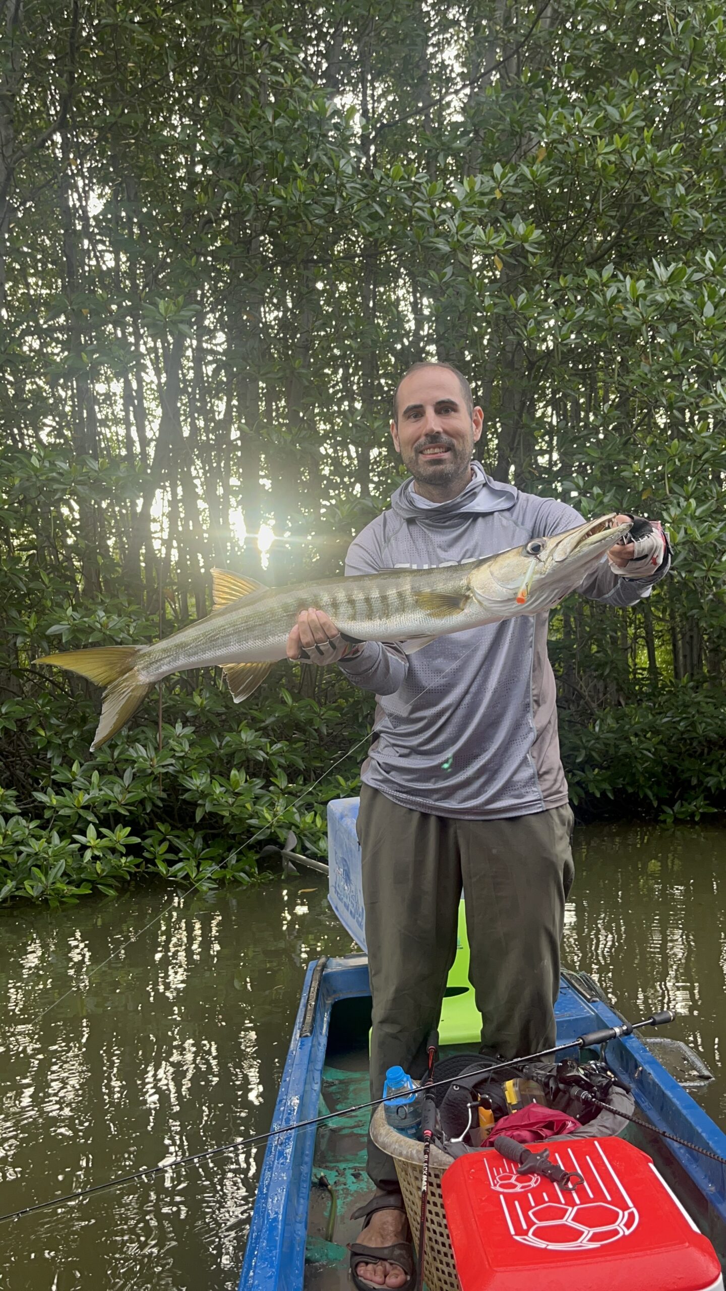 Guest showing caught fish during guided mangrove forest tour