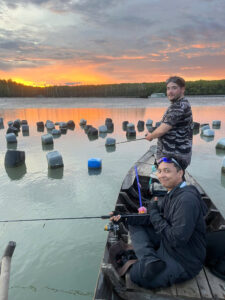 Angler fishing near oyster farms in Vietnam’s wild rivers at the river mouth