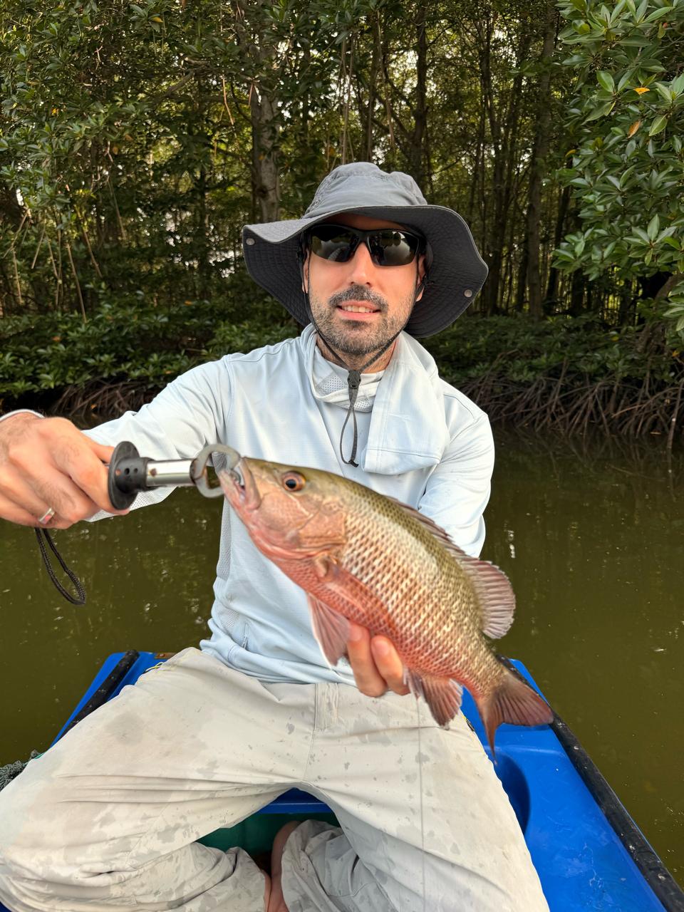 Angler lure fishing in the wild mangroves near Ho Chi Minh City, Vietnam